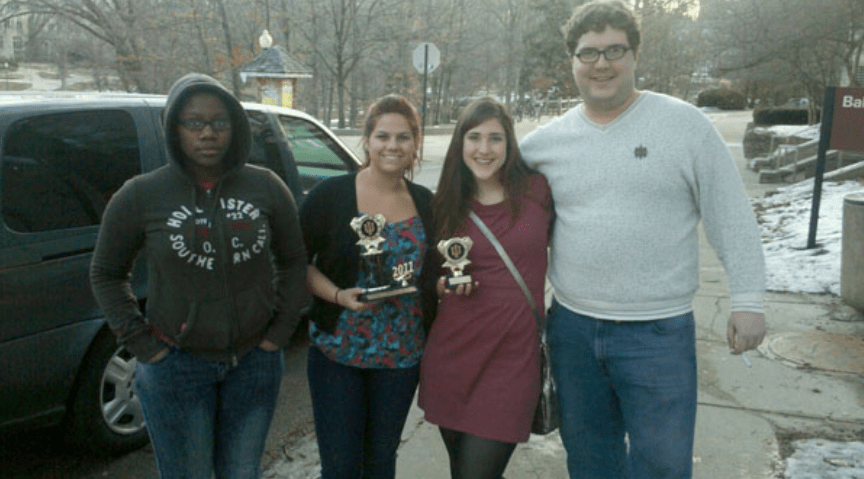 Students holding the Forensics awards.